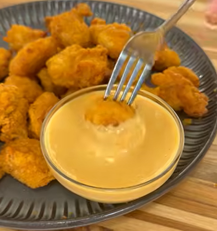 Copycat Chick-fil-A Sauce on a dark backdrop with fresh ingredients