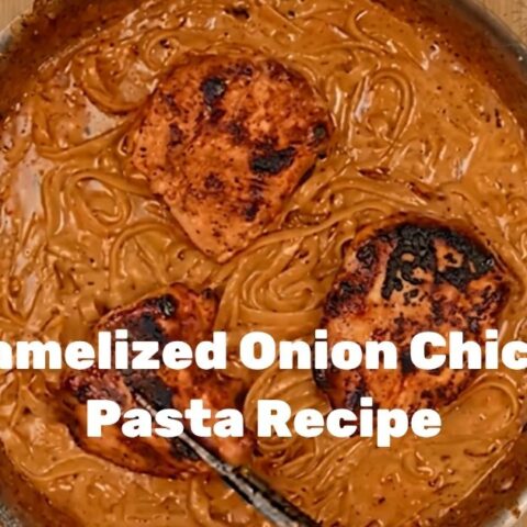 Creamy Caramelized Onion Chicken Pasta served in a shallow bowl with fresh parsley and grated parmesan