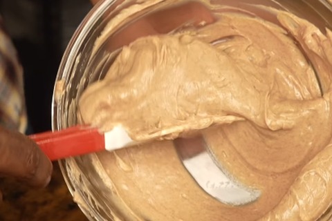 Whipped fluffy cinnamon butter in a glass bowl ready for spreading
