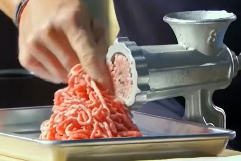Freshly grinding beef chuck and short rib for Gordon Ramsay burger patty blend