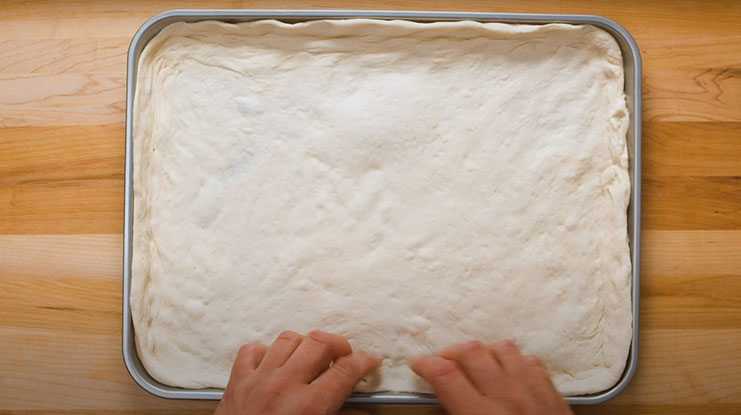 Place your pizza dough on the tray